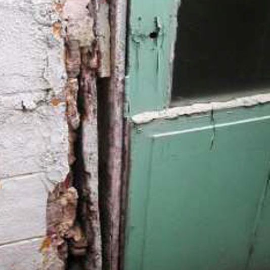 Weathered door frame and masonry
